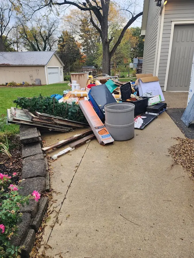 Dumpster being loaded with debris for 3 Yard Dumpster Rental in Prescott Valley